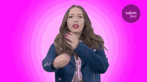 a woman dancing in front of a pink background with a salon line logo