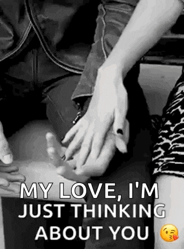a man and a woman are holding hands in a black and white photo and the woman is thinking about you .