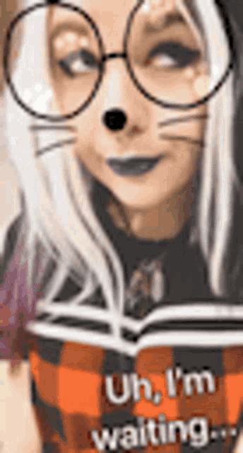 a woman wearing glasses and a cat face mask is waiting for something .