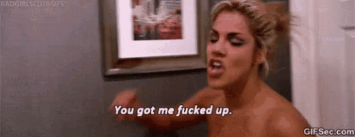 a naked woman is standing in a bathroom with a picture on the wall and saying `` you got me fucked up '' .