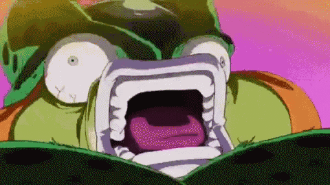 a close up of a cartoon character with a huge mouth open .
