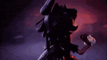a blurred image of a person holding a gun in a dark room
