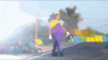 a person in a mario costume is walking down a street