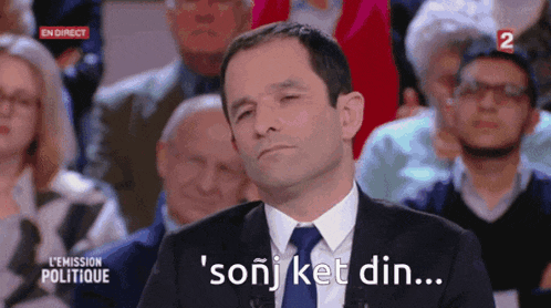 a man in a suit and tie says ' sonj ket din ... '