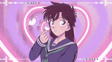 a girl in a school uniform is making a heart sign