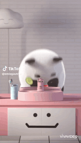 a panda bear is brushing his teeth in a pink sink