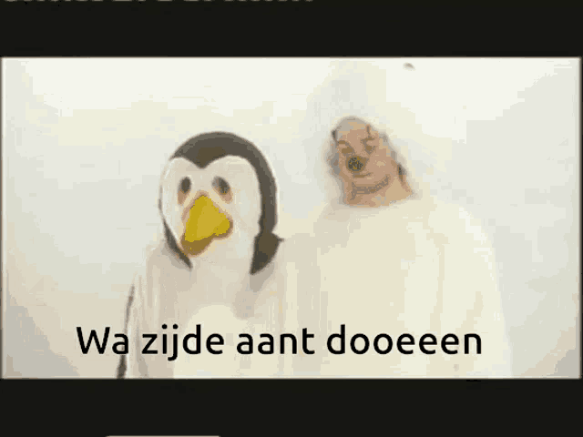 two people in penguin costumes are standing next to each other with the words wa zijde aant dooeeen below them