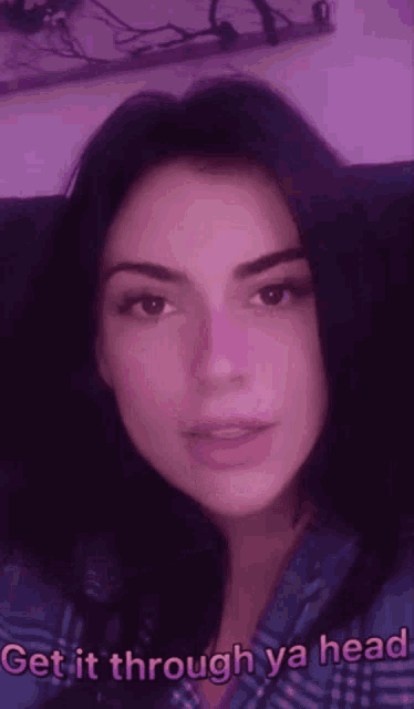 a woman says get it through ya head on a purple background