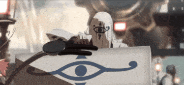 a man with a third eye on his head sits at a table