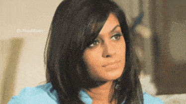 a close up of a woman 's face with the words " the man " visible in the corner