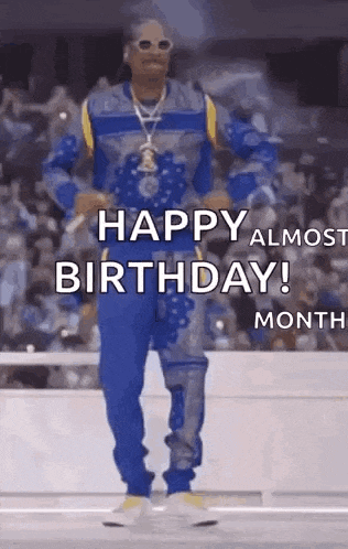 snoop dogg is dancing in front of a crowd and saying happy almost birthday !