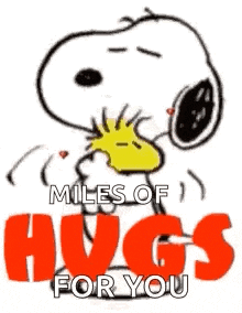 snoopy and woodstock are hugging each other and holding hearts in their mouths .