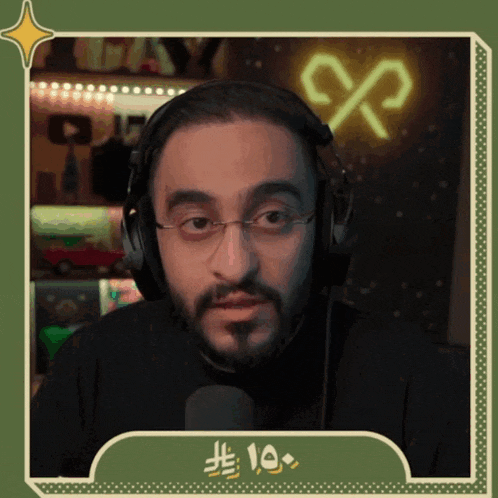 a man wearing headphones and glasses with the number fifteen on the bottom