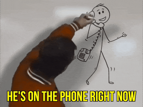a man is drawing a stick figure on a wall with the words he 's on the phone right now