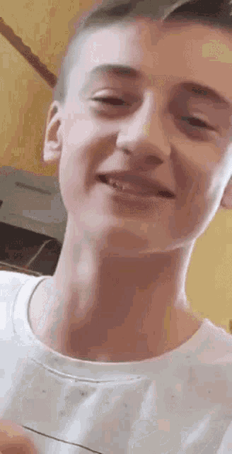 a close up of a young man 's face with his eyes closed .