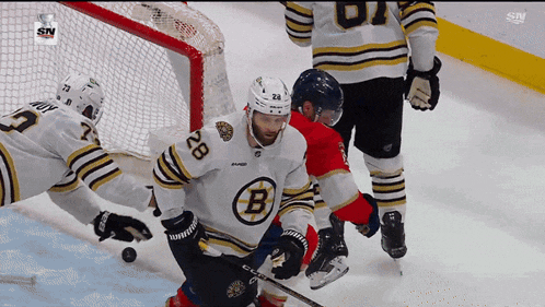 a hockey player with the letter b on his shirt