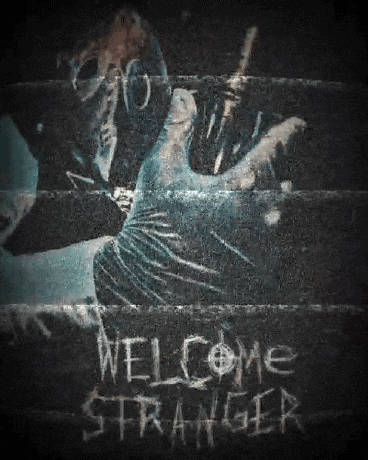 a welcome stranger sign is written on a wall
