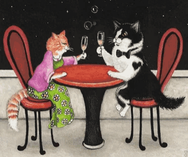 two cats are sitting at a table toasting with champagne glasses