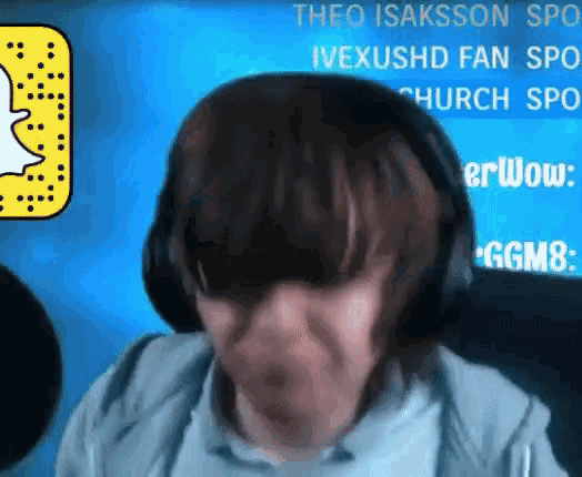 a person wearing headphones is sitting in front of a screen that says theo isaksson spo