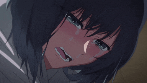 a close up of a girl crying with tears coming out of her eyes