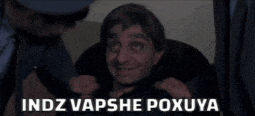 a man is being held by two police officers and the words indz vapshe poxuya are above him
