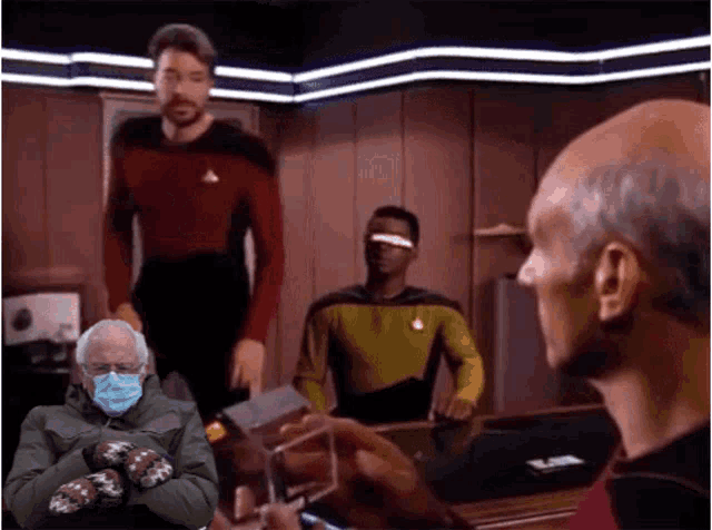 bernie sanders is wearing mittens and a mask