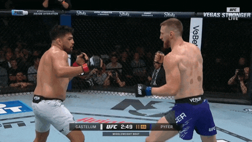two men are fighting in a boxing ring with the ufc logo on the bottom