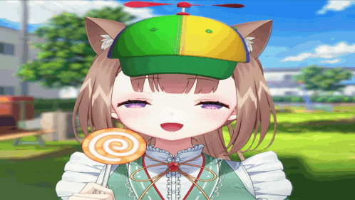 a girl wearing a hat and holding a lollipop with the letter c on it