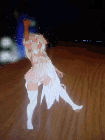 a computer screen shows a girl in a pink dress and white thigh high socks