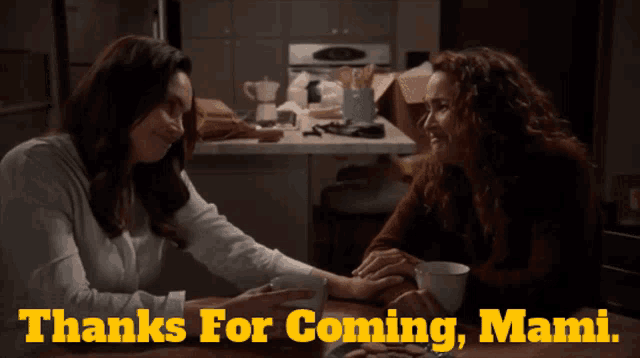 two women holding hands with the words thanks for coming mami