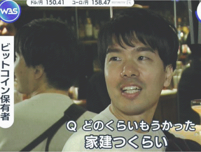 a man in a white shirt is smiling in front of a sign that says was