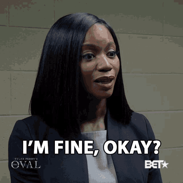 a woman says " i 'm fine okay " in front of a beta logo