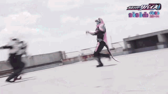 a group of people are standing in front of a sign that says ' kamen rider revive '