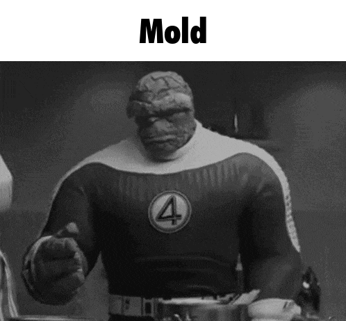 a black and white photo of a superhero with the word mold written on it .
