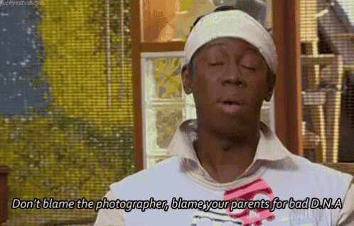 a man with a bandana on his head is saying " do n't blame the photographer blame your parents for bad dna "