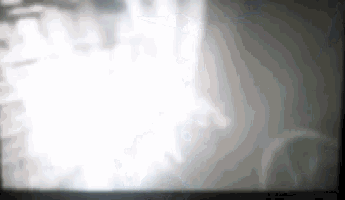 a close up of a screen with a blurred image of a person 's face .