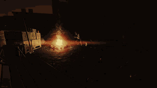 a dark room with a fire and boxes with the letters g and g on them