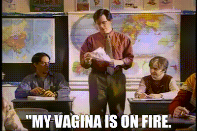 a man stands in front of a classroom with the words " my vagina is on fire "