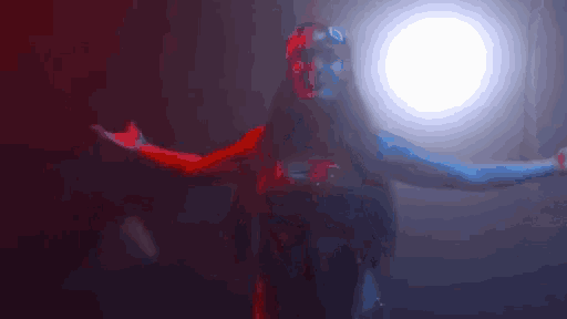 a woman with red and blue paint on her face is dancing