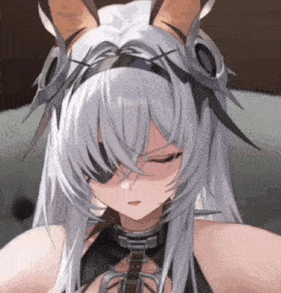 a close up of a girl with long white hair wearing a headband and a collar .