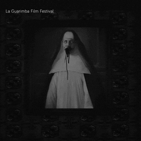 a black and white photo of a nun with blood coming out of her mouth is from the la guarimba film festival