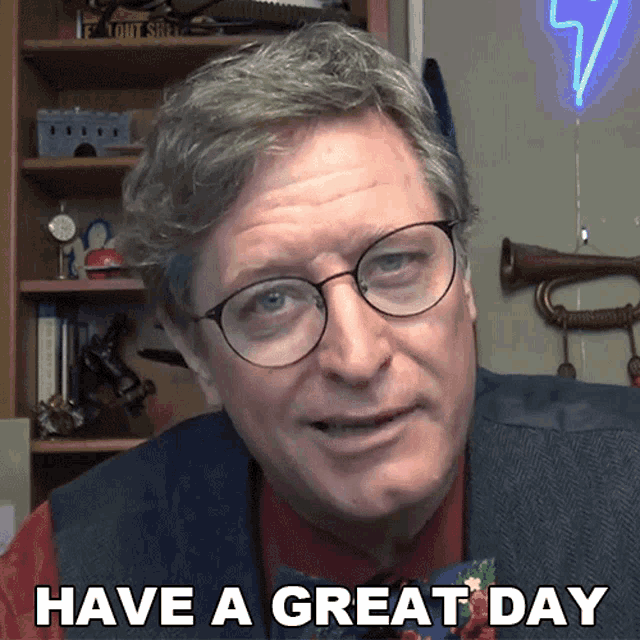 a man wearing glasses and a red tie says have a great day