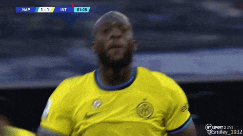 a soccer player in a yellow jersey celebrates a goal during a game