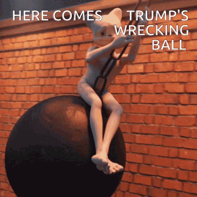 a statue of a person sitting on a ball with the words here comes trump 's wrecking ball written below it
