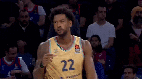 a basketball player wearing a yellow jersey with the number 22 on it