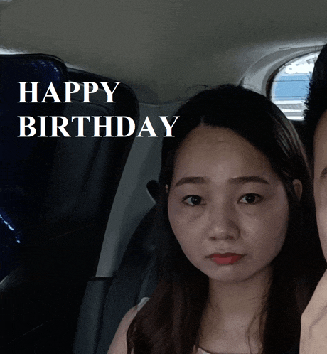 a woman sitting in a car with the words happy birthday behind her