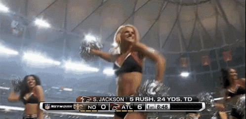 a cheerleader is dancing in front of a scoreboard that says s. jackson 5 rush 24 yards td