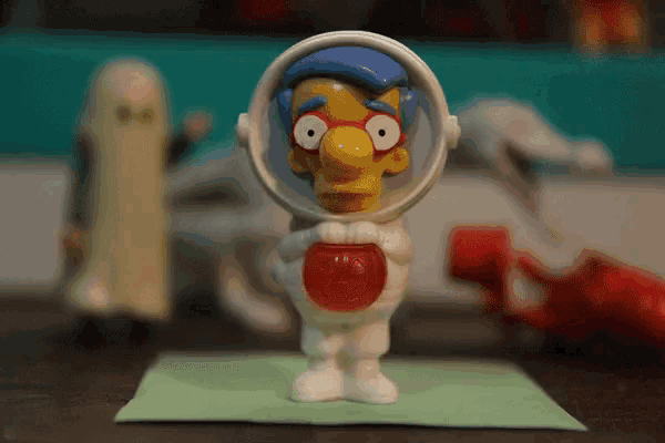 a mcdonald 's happy meal toy of milhouse simpson in an astronaut outfit