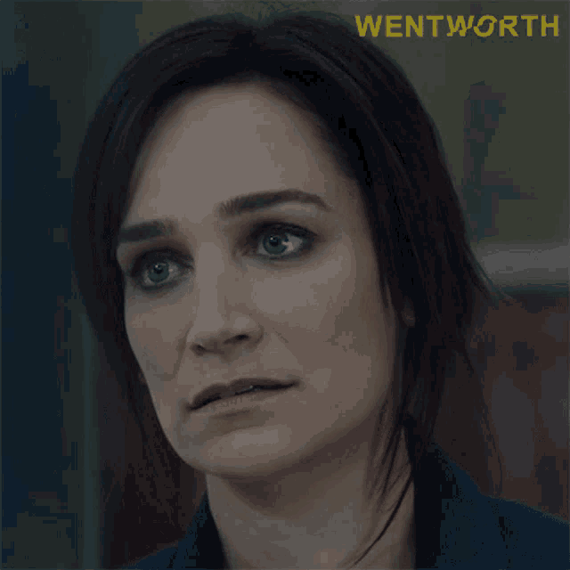 a close up of a woman 's face with the word wentworth on the bottom right