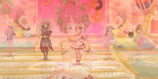 a girl in a dress is standing on a stage in front of a wall of donuts .